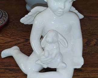 Beautiful angel holding bunny