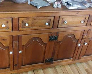 Bottom of pine Hutch has four opening cabinets and four deep drawers for storage