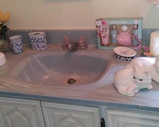 Check out the master bathroom vintage ceramic cats and more