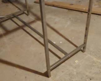 There are two industrial clothes racks in the basement you can only reach the basement by going around to the back of the house down a couple of steps