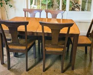 Beautiful all wood table and six chairs with extra Leaf underneath