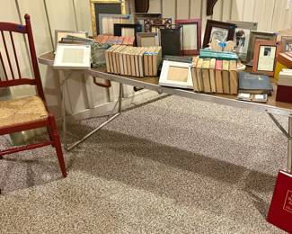 Burgundy rush seat upright chair $35; books & frames. 