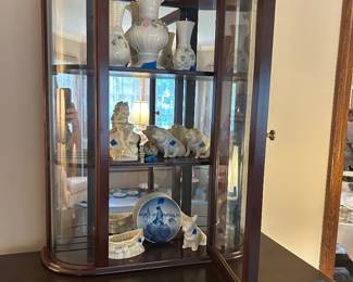 Belleek figurines available; Bombay Co. 3 shelf curved glass with mirror back wall curio sold  $175