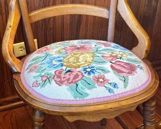 Antique wood bowed arm chair with embroidered seat $85