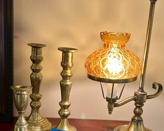 Vintage14.5” H brass with amber glass shade side arm $40; brass taper candle stick holders. 