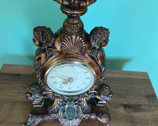 Ornate Quartz clock 12" tall; some damage to one foot; $18