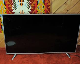 One  of Two Large Flat HD Screen Televisions 