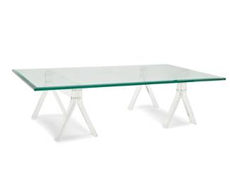 318 A Modern glass and acrylic coffee table Late 20th century The beveled glass top raised on two sawhorse-form acrylic supports 3 pieces Each support: 15.125" H x 28.125" W x 12.5" D; Glass: 60" W x 36" D Estimate: $400 - $600