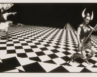 167 Jeff Bridges (b. 1949) "Julianne Moore, Valkyrie, From The Big Lebowski," 1998 Gelatin silver print on paper Edition: 1/15 Signed in ink in the lower margin, at right: Jeff Bridges; signed again, titled, dated, and inscribed in pencil, all verso: ©1998 / "JBA-BL/1-15" Image: 4" H x 9.375" W; Sight: 4.375" H x 9.75" W Estimate: $300 - $500