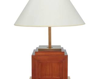 319 Romeo Rega (1925-1984) A Modern wood and brass table lamp, late 20th century Base impressed with factory marks: [RR cipher] / Romeo Rego / MADE IN ITALY Issuing two lights, surmounted by a paper shade, electrified Lamp: 29" H x 12" W x 12" D; Shade: 10.5" H x 19" Dia. Estimate: $400 - $600