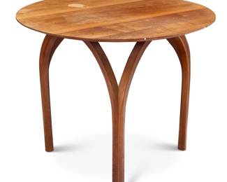 370 A Thomas Moser cherry wood 'Vault' side table Early 21st century Unmarked Raised on arched legs 21" H x 26" Dia. Estimate: $200 - $400