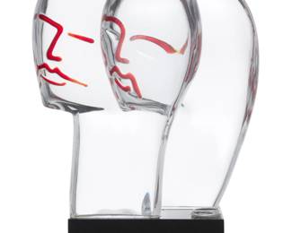 75 Loredano Rosin (1936-1992) A Murano art glass sculpture of two heads, late 20th century Base etched with signature: Loredano Rosin; and with applied glass seal: LOREDANO ROSIN / MURANO VENEZIA Glass on black glass base Overall: 17.25" H x 11.5" W x 6.25" D Estimate: $700 - $900