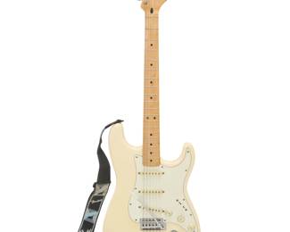 372 A Fender Stratocaster electric guitar 1997 With printed factory marks and serial number to headstock: MN6124654 Housed in vinyl padded case With tremolo bar: 39" H x 13" W x 5.5" D Estimate: $800 - $1,200