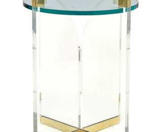 80 Charles Hollis Jones (b. 1945) A Lucite 'Fleur-de-Lis' occasional table, late 20th century Unmarked With gold-toned metal accents and circular glass top 27" H x 22.25" Dia. Estimate: $600 - $800