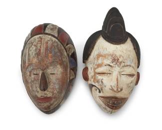 375 Two African polychrome carved wood masks Gabon; 20th century Comprising a Punu-Lumbo mask and a Fang Ngongtang mask 2 pieces Punu: 15.5" H x 8.75" W x 6" D; Fang: 13.5" H x 8.5" W x 6.5" D Estimate: $400 - $600