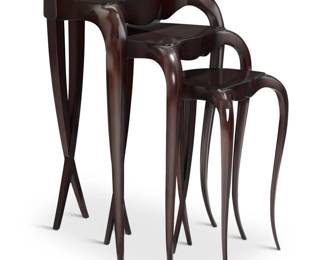 14 Christopher Guy (1960-2020) A nest of three tables, early 2000s Two incised to underside: 12963 TB 00 0027c Each triangular top with shaped apron, raised on front cabriole and rear crisscross legs 3 pieces Largest: 27.5" H x 19.625" W x 16.5" D; Smallest: 19.75" H x 12.5" W x 10.125" D Estimate: $400 - $600