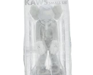 337 Brian "KAWS" Donnelly (b. 1974) "Small Lie" (grey), 2017 Painted cast vinyl Signed, dated, and titled in marker to the underside of left foot; further marked under right foot: KAWS..17 / Medicom Toy / China Figure: 11" H x 5" W x 4.5" D; Packaging: 12" H x 6.25" W x 6" D Estimate: $400 - $600