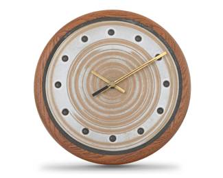 376 A Jane & Gordon Martz wall clock for Marshall Studios Mid-20th century Unmarked The quartz movement clock with glazed stoneware dial bearing dotted hour markers, electrified 11.5" Dia. x 2.625" D Estimate: $400 - $600