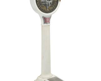 373 A Mills Novelty Co. lollipop coin op scale 1920s With factory metal plate applied to interior of dial White painted porcelain over iron, with glazed dial reading 'YOUR EXACT WEIGHT', raised on a columnar standard 74.75" H x 22.5" W x 28" D Estimate: $600 - $800