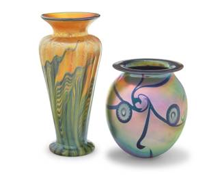 85 Two Contemporary iridescent art glass vases 1997 Lundberg etched: Lundberg Studios / 1997 / 062612; Eickholt with incised signature and date: Eickholt / VSMI Comprising a Lundberg Studios pulled feather vase and a Robert Eickholt (b. 1947) vase with murrini accents 2 pieces Lundberg: 7.5" H x 3.375" Dia.; Eickholt: 5" H x 4.375" Dia. Estimate: $200 - $300