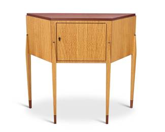295 A Postmodern exotic wood console cabinet Late 20th/early 21st century Unmarked With single cabinet door and burlwood top 42.25" H x 46.5" W x 18" D Estimate: $400 - $600