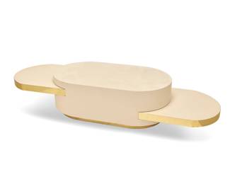 82 In the manner of Gabriella Crespi (1922-2017) An 'Ellisse' style coffee table, late 20th century Marked to underside of one pull-out surface: FAHRENHOLZ / FURNITURE / COMP. The painted wood table with gold-toned metal trim and opposed pull-out extensions Extended: 17.125" H x 85" W x 28.25" D; Stored: 48.25" W Estimate: $700 - $900