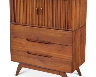 369 A Modern tambour stacking dresser Late 20th/early 21st century Unmarked The upper section with tambour shutter doors opening to reveal a single shelf set on a chest of three drawers with recessed pulls, raised on angled tapered legs 2 pieces Top: 15.25" H x 36" W x 18.5" D; Bottom: 29.75" H x 36.25" W x 18.75" D Estimate: $400 - $600