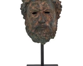 20 A Grand Tour style cast metal head of a Greek figure 20th century With verdigris patination, mounted on an enameled metal pedestal Head: 13.5" H x 9.75" W x 11" D; Overall: 21.5" H Estimate: $400 - $600