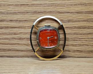 MCM Sheffield Pendant Watch. Red faced gold tone modernistic style