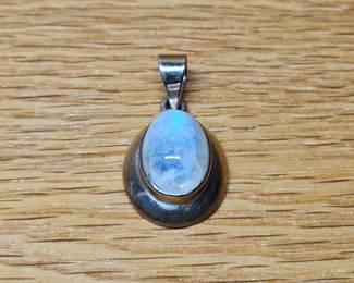 Moonstone Pendant set in Sterling. A 10mm x 15mm x 5mm high moonstone cabochon in a chunky Sterling Setting.