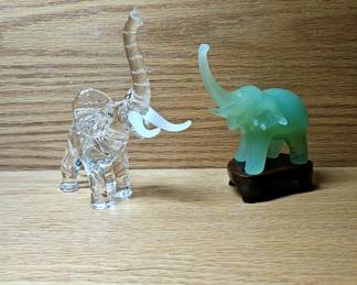 Two Glass Elephants one with stand.