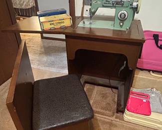 Vintage sewing machine with seat