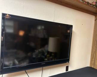 Large newer tv with stand and remote