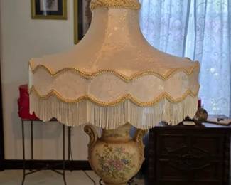 Floral porcelain lamp with fringe shade