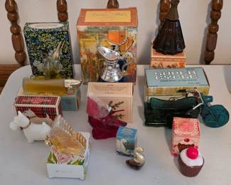 Collection of vintage Avon perfumes with boxes