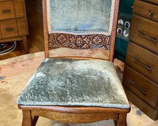 Vintage oak “North Wind” carved chair with velvet upholstery, 19th century. 