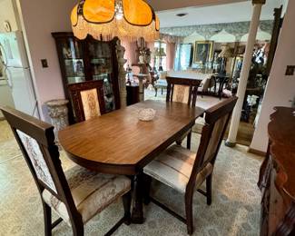 Antique Victorian Dining Table and Four Victorian newly reupholstered chairs.