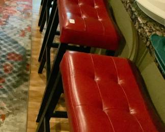 Red Leather stools with black frames. Striking!
