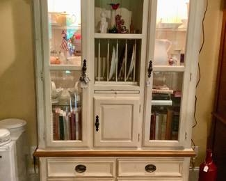 Great display cabinet with doors, plate slots, drawers and a pull out shelf.