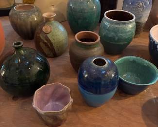 lots of beautiful pottery vases and bowls