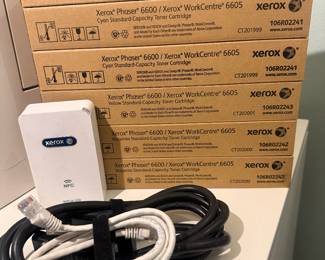 (Included with Printer) 6 toner boxes for the Xerox 6605 printer (2 yellow, 2 cyan, 2 magenta) and a Xerox Wireless Print Solutions Adapter.