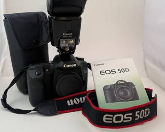 Canon EOS 50D with original manual, external flash (with case), batteries, and chargers
