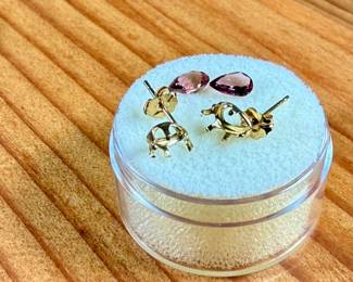 This lot features a pair of (.80 carats) tourmaline gemstones and a set of 14k gold earrings to fit them.
