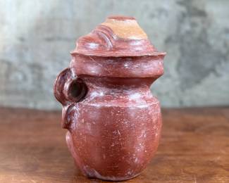 This lot features a pre-columbian style effigy vessel in good overall condition that measures, 10” H x 8” W x 7” D.