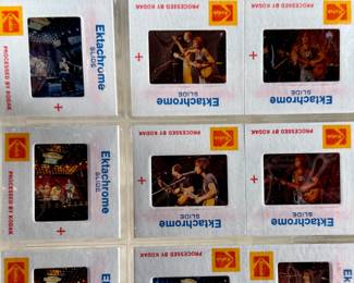 Vintage 35mm slides primarily organized in a transparent holder. Each slide features labels with the name “Richard Creamer” and addresses in Beverly Hills and Los Angeles, CA. Subjects documented include notable music acts such as Seals & Crofts and Donna Summer.