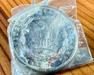 This lot features a 1882-S Morgan Dollar.