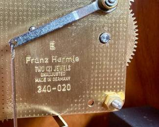 This lot features an Emperor Mantel Clock in good working condition with a key. This clock measures, 15” H x 11” W x 6” D. Franz Hermle two (2) jewel movement.