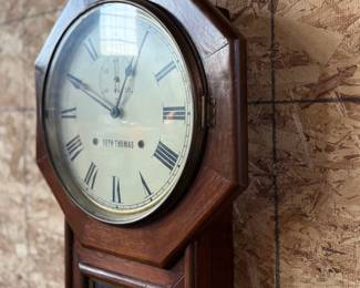 This lot features a Seth Thomas “World” model long-drop schoolhouse clock from the late 19th century.  It features a distinctive octagonal top and a long lower case for the pendulum. Tested and in good working condition with key. Measures, 32” H x 17” W.