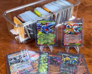 This lot features a large Pokemon trading card collection full of holos, bulk, ex cards, full art, and more. Some Japanese & Korean cards included too!