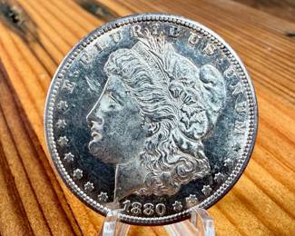 This lot features a 1880-S Morgan Dollar.